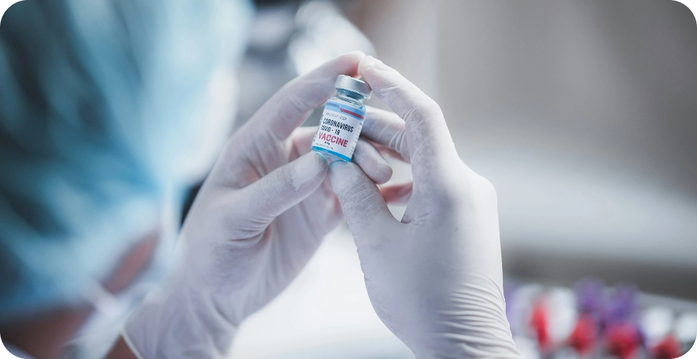Researcher holding a vial in a lab